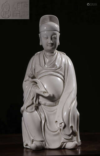 A WHITE GLAZE FIGURE STATUE