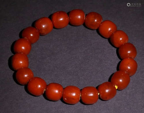 AN OLD AMBER STRING BRACELET