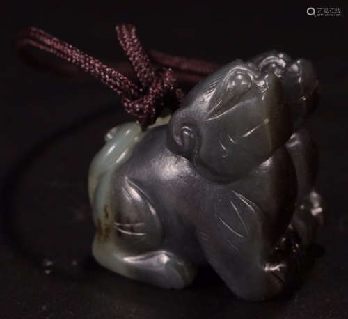 A HETIAN JADE BEAST PENDANT