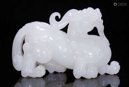 A HETIAN JADE BEAST PENDANT