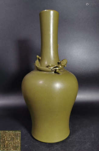 A GREEN GLAZE VASE CARVED WITH BEAST