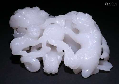 A HETIAN WHITE JADE BEAST PENDANT