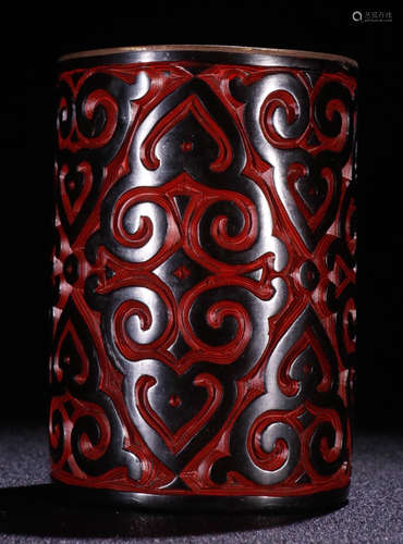 A RED LACQUER BRUSH POT CARVED WITH PATTERN