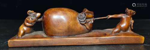A HUANGYANG WOOD PAPERWEIGHT CARVED WITH MOUSE