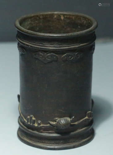 A COPPER BRUSH POT CARVED WITH BEAST