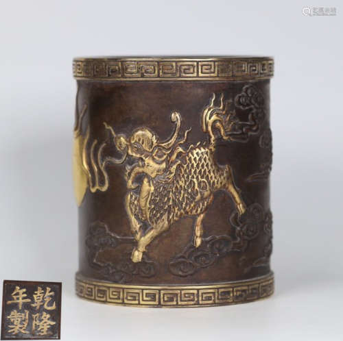 A GILT BRONZE BRUSH POT CARVED WITH QILIN