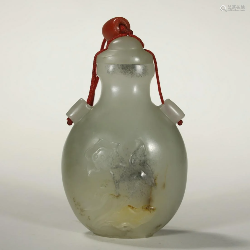 A RARE CARVED WITH WHITE JADE SNUFF BOTTLE