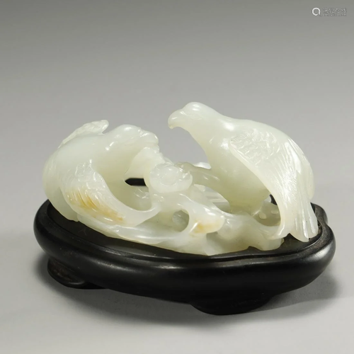 A CARVED WHITE JADE BIRDS