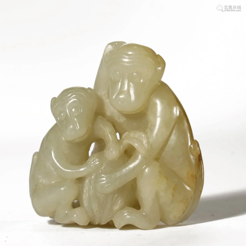 A CARVED WHITE JADE MONKEYS