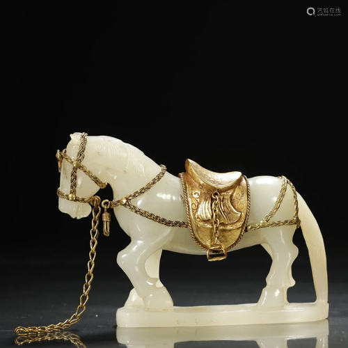 A GILT-SILVER MOUNTED WHITE JADE HORSE