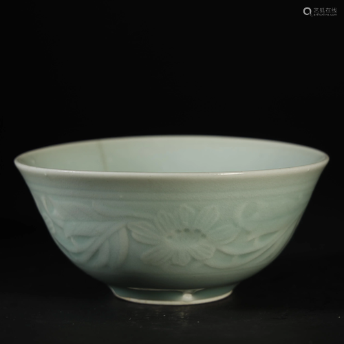 A RARE MOULDED AND CARVED CELADON-GLAZED B…