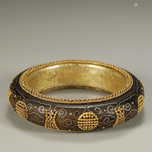 AN ARCHAIC GOLD AND SILVER-INLAID WITH CH…