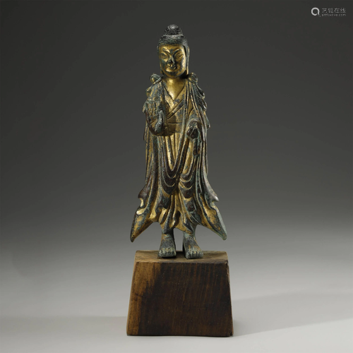 AN ARCHAIC GILT-BRONZE SAKYAMUNI