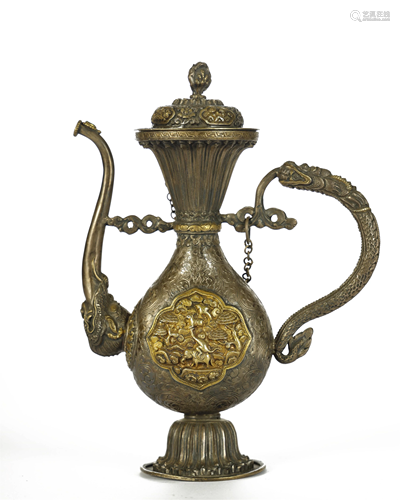 AN ARCHAIC TIBETAN GILT-SILVER EWER