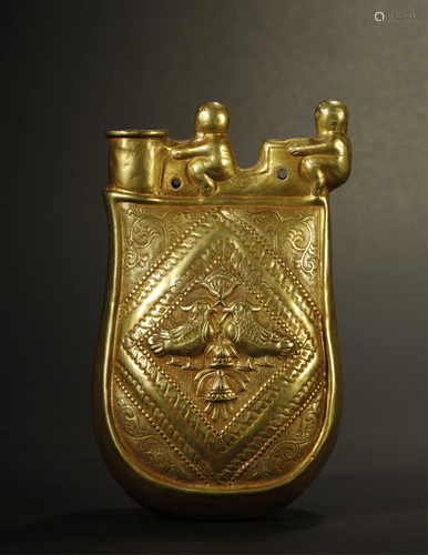 AN ARCHAIC GILT-SILVER FLASK