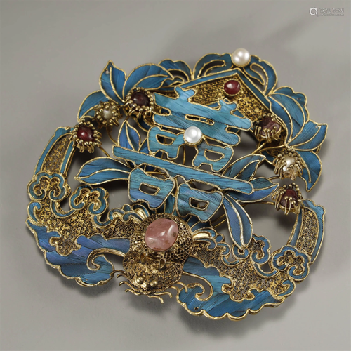 A GILT-SILVER CROWN AND GEMSTONE