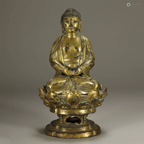 ARCHAIC CHINESE A GILT-BRONZE BUDDHA SAKYA…