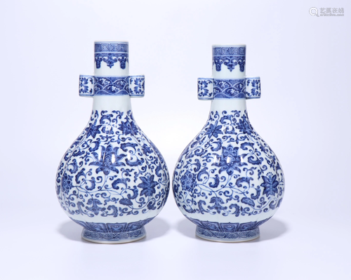 A PAIR OF CHINESE BLUE AND WHITE LOTUS VAS…