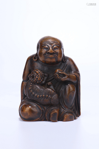 A CHINESE BAMBOO CARVED FIGURE OF SEATED L…