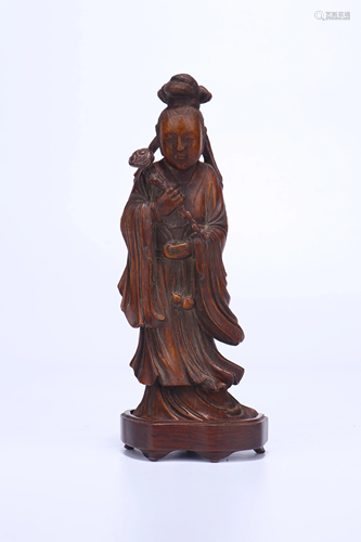 A CHINESE BAMBOO CARVED FIGURE OF GUANYI…