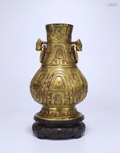 A CHINESE GILT BRONZE VASE WITH WOOD …