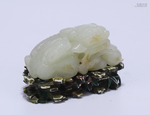 A CHINESE FINE WHITE JADE MYTHICAL BEAST WITH …