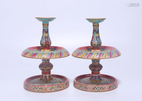 A PAIR OF CHINESE FAMILLE ROSE CANDLE STICK…