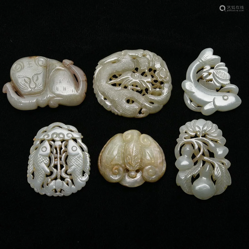 A Group of Eight Celadon Jade Carvings.