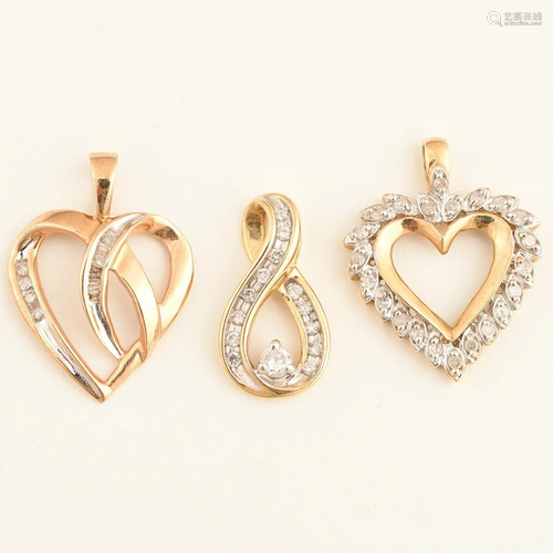 Collection of Three Diamond, Yellow Gold Pendants.