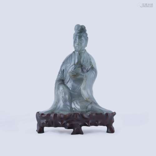 A CARVED JADEITE FIGURE OF GUANYIN, QING DYNASTY