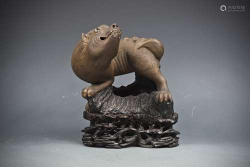 A ZISHA PIXIU FIGURINE  WITH CARVED HARDWOOD STAND