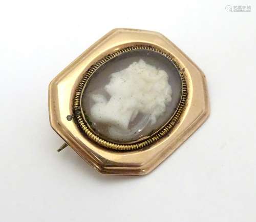 A Victorian cameo brooch, the central cameo behind locket glass within a yellow metal rose gold