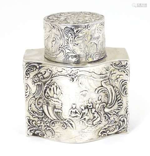 A Dutch silver caddy embossed with various scenes and scroll detail bearing marks for Berthold