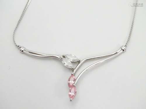 A 9ct white gold necklace set with pink and white cubic zirconia. Approx 17