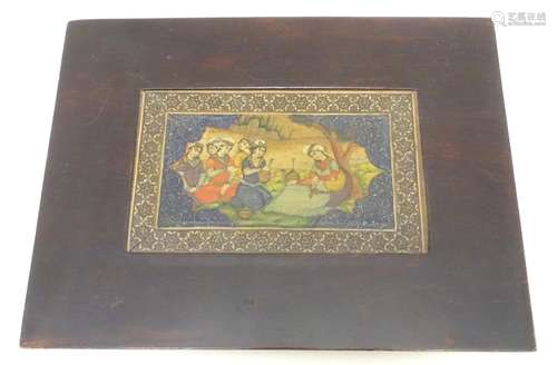 A 19thC Indian painting on a framed sheet bone, depicting a figures seated in a landscape. Approx. 3