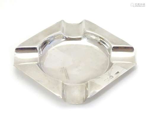 A silver ashtray hallmarked Chester c.1920's maker Dingley Bros marked with retailers stamp for