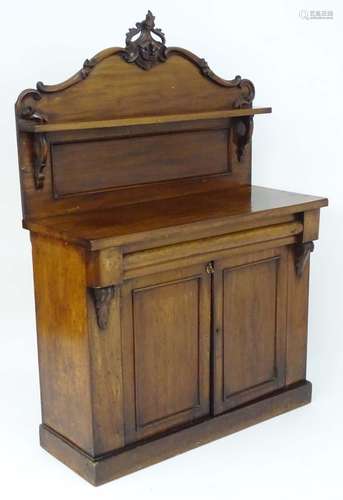 A late 19thC mahogany chiffonier with a carved up stand and single shelf above a rectangular top and