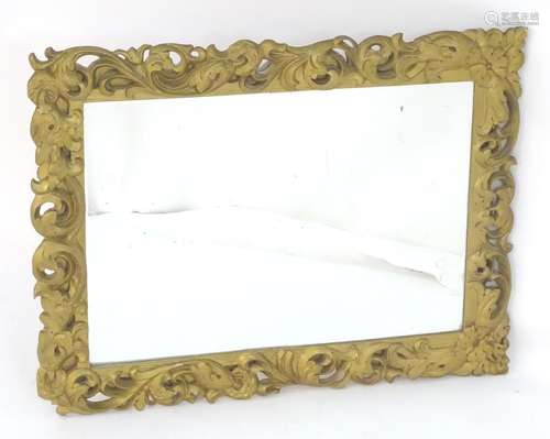 A late 20thC mirror with a pierced giltwood frame and bevelled mirror edge. 36