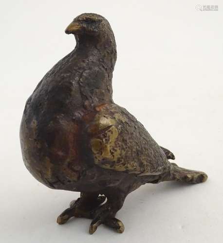 A 20thC bronze model of a pigeon, signed H.S. under. Approx. 4