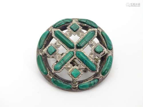 A late 19thC / early 20thC Scottish brooch of oval form set with malachite detail. White metal (