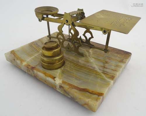 A 19thC set of Sampson Mordan & Co. brass postal scales and weights, upon a marble base. Stamped S