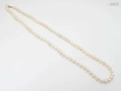 A pearl necklace with 14ct gold clasp. 24