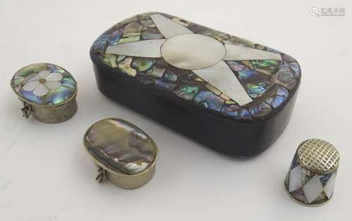 A papier mache snuff box, the hinged lid with mother of pearl and abalone decoration. Together