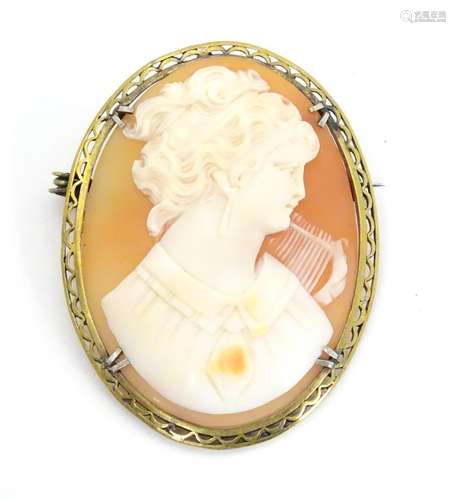 An early 20thC brooch set with oval cameo in a gilt metal mount. 1 3/4