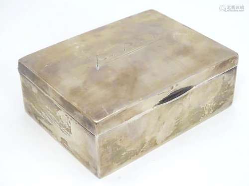 A silver table top cigarette box with wood lined interior. Hallmarked Birmingham 1908 maker A & J