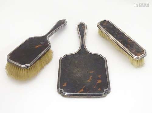 Three silver and tortoiseshell backed dressing table brushes. Hallmarked London 1927 maker Richard