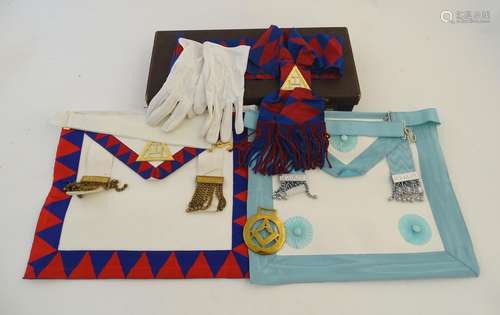 Freemasonry interest: a boxed assortment of masonic regalia, comprising two aprons (one labelled