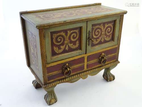 A 20thC table cabinet with a painted exterior, panelled doors and to short drawers with ring pull