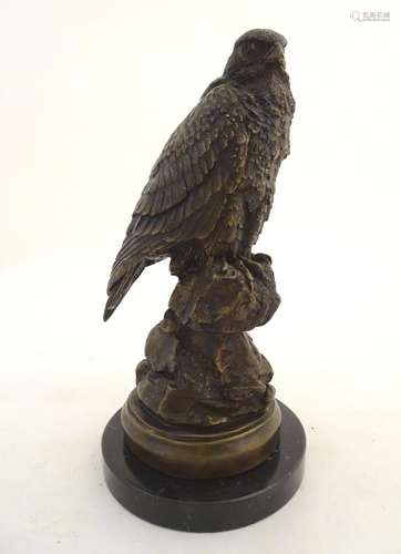 An early-20thC cast model of an eagle, mounted upon a black marble base. 11 1/2