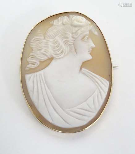 A 19thC shell carved cameo within a 9ct gold brooch setting. 1 3/4